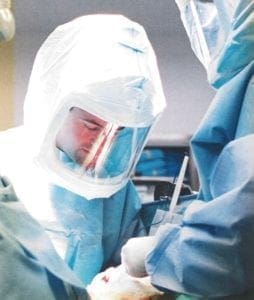 Dr. Alessandro performing joint replacement surgery